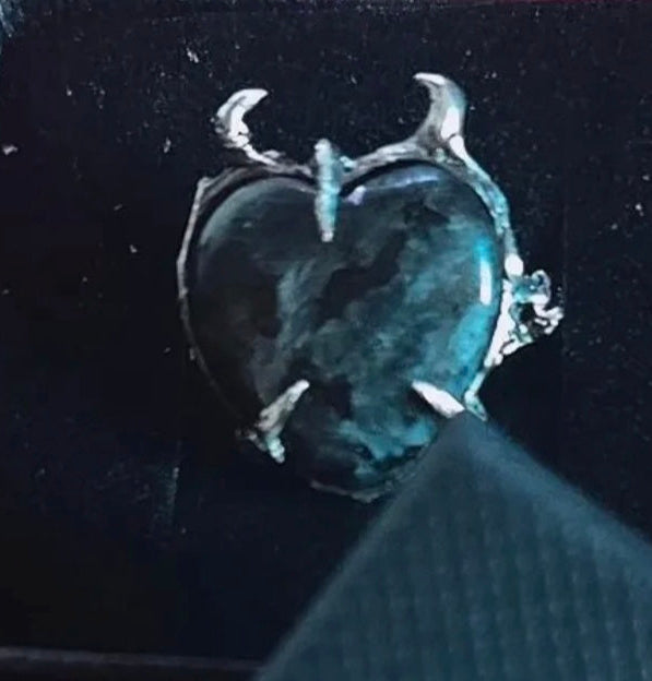 Heart-shaped silver ring with horns 