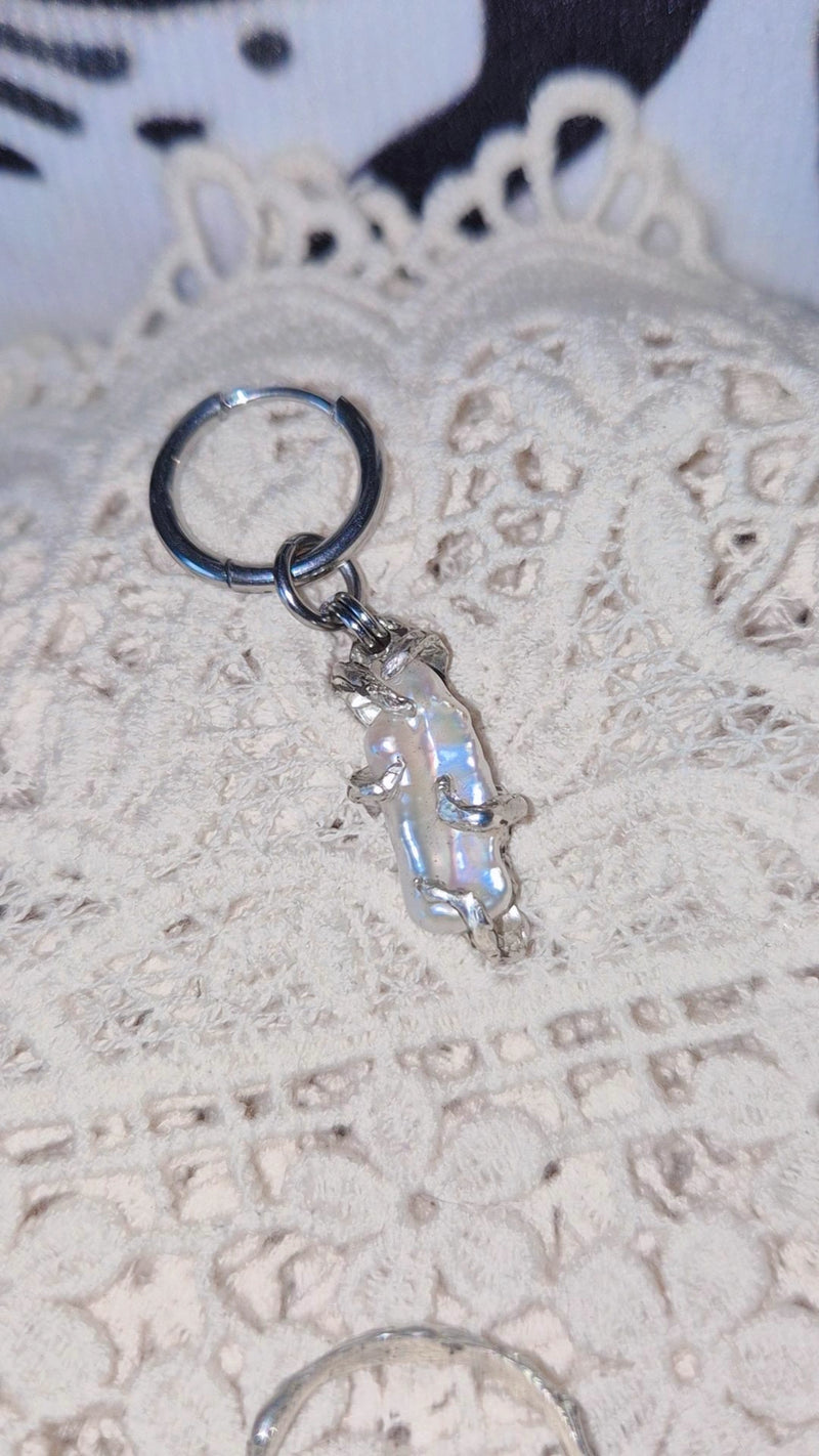 Silver earring with a pearl