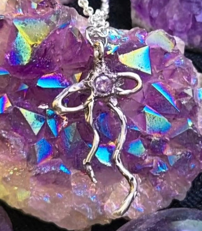 Necklace with a ribbon pendant with amethyst crystal 